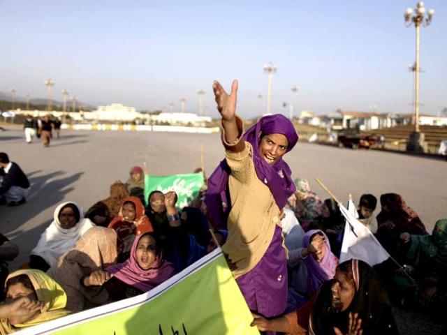 Pakistani labourers chant slogans during a protest demanding their government to provide them with permanent jobs, near the parliament in Islamabad, Pakistan. (AP Photo)