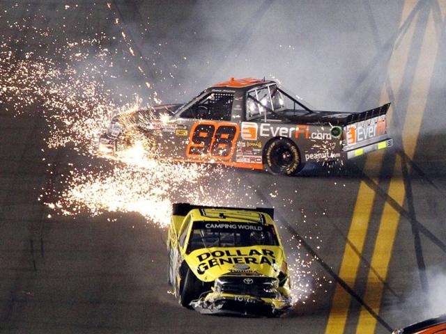 Jason Leffler in his number 18 Toyota (bottom) and Dakoda Armstrong in his number 98 Toyota crash during the NASCAR Camping World Series NextEra Energy Resources 250 truck race at the Daytona International Speedway in Daytona Beach, Florida. (Reuters)