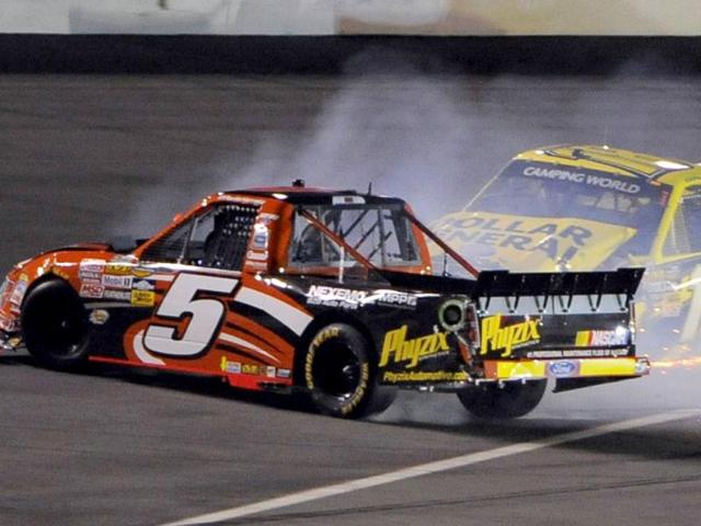 Jason Leffler (R) in his number 18 Toyota collides with Paul Harraka in his number 5 Ford during the NASCAR Camping World Series NextEra Energy Resources 250 truck race at the Daytona International Speedway in Daytona Beach, Florida. (Reuters)