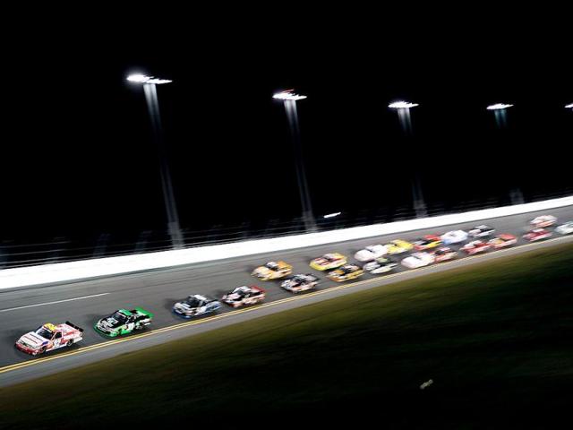 Miguel Paludo, driver of the #32 Duroline Brakes and Components Chevrolet, leads the field during the NASCAR Camping World Truck Series NextEra Energy Resources 250 at Daytona International Speedway in Daytona Beach, Florida. (AFP Photo)
