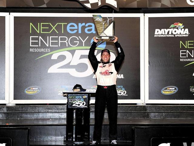 John King, driver of the #7 Red Horse Racing Toyota, poses in Victory Lane after winning the NASCAR Camping World Truck Series NextEra Energy Resources 250 at Daytona International Speedway in Daytona Beach, Florida. (AFP Photo)