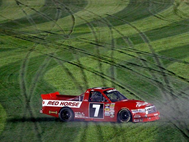 John King, driver of the #7 Red Horse Racing Toyota, celebrates with a burnout after winning the NASCAR Camping World Truck Series NextEra Energy Resources 250 at Daytona International Speedway in Daytona Beach, Florida. (AFP Photo)
