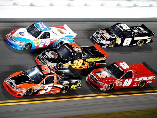Paulie Harraka, driver of the #5 Wauters Motorsports Ford, leads Ryan Sieg, driver of the #39 Pull A Part LLC Chevrolet, Max Gresham, driver of the #24 Made in USA Brand Chevrolet, Clay Greenfield, driver of the #68 Dawn Stanfill Foundation Dodge, and Mike Skinner, driver of the #8 Eddie Sharp Racing Chevrolet, during the NASCAR Camping World Truck Series NextEra Energy Resources 250 at Daytona International Speedway in Daytona Beach, Florida.(AFP Photo)