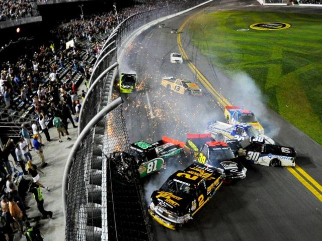 Brendan Gaughan, driver of the #2 South Point Hotel ' + char(38) +' Casino Chevrolet, David Starr, driver of the #81 Zachry Toyota, Ryan Sieg, driver of the #39 Pull A Part LLC Chevrolet, Nelson Piquet Jr., driver of the #30 Qualcomm/Autotrac Chevrolet, Parker Kligerman, driver of the #29 Cooper Standard Dodge, Chris Fontaine, driver of the #84 Glenden Enterprises Toyota, Johnny Sauter, driver of the #13 Hot Honeys Toyota, and Matt Crafton, driver of the #88 Ideal Door/Menards Toyota, wreck during the NASCAR Camping World Truck Series NextEra Energy Resources 250 at Daytona International Speedway in Daytona Beach, Florida. (AFP Photo)