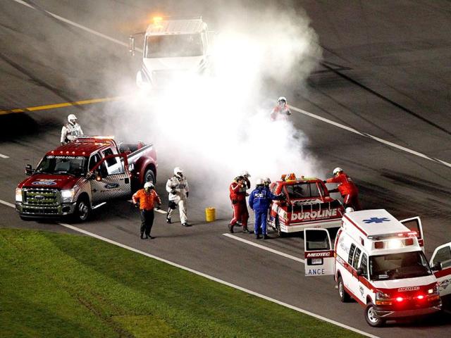 Safety workers tend to Miguel Paludo, driver of the #32 Duroline Brakes and Components Chevrolet, after hitting the wall during the NASCAR Camping World Truck Series NextEra Energy Resources 250 at Daytona International Speedway in Daytona Beach, Florida. (AFP Photo)
