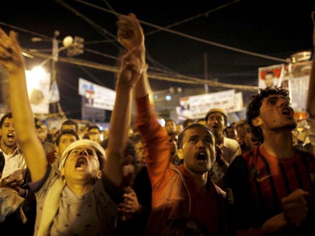 Anti-government protesters shout slogans at Taghyeer (Change) Square as the results of the presidential elections are announced in Sanaa. Reuters/Khaled Abdullah