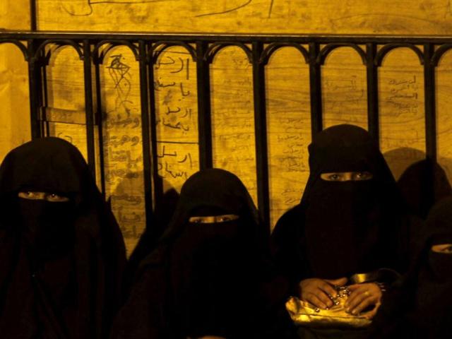 Women anti-government protesters sit at Taghyeer (Change) Square as the results of the presidential elections are announced in Sanaa. Reuters/Khaled Abdullah