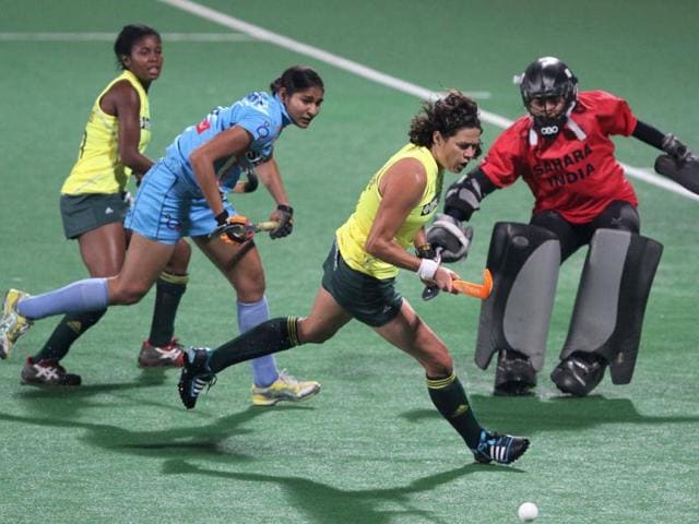 South African Pietie Coetzee and Indian goalkeeper Yogita Bali in action during the FIH London Olympics Hockey Qualifiers at the Major Dhyan Chand National Stadium in New Delhi. HT Photo/Virendra Singh Gosain