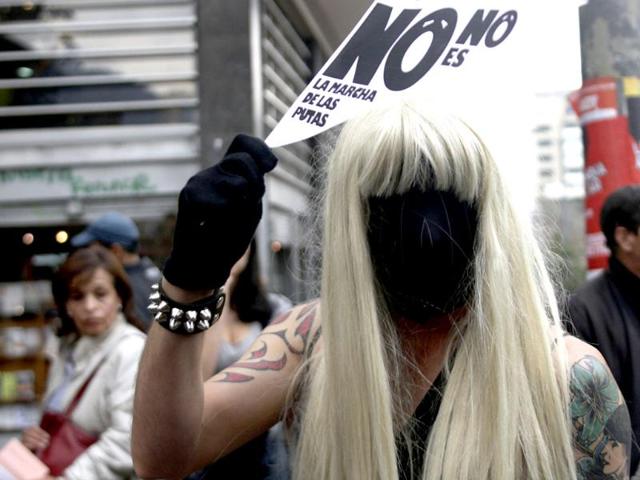 A man in a wig and mask takes part in a 'March of the whores' to protest against discrimination and violence against women in Bogota. Reuters/Fredy Builes