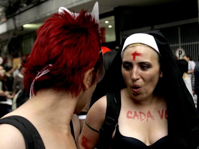 A woman dressed to represent a nun takes part in a 'March of the whores' to protest against discrimination and violence against women in Bogota. Reuters/Fredy Builes