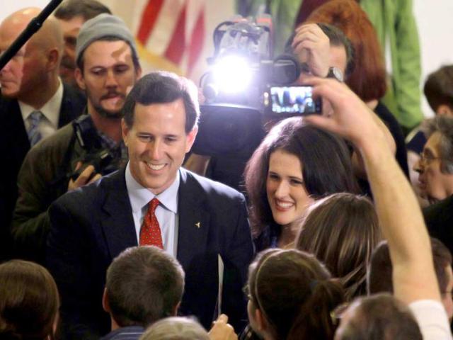 Republican presidential candidate, former Pennsylvania Sen. Rick Santorum (L) with his daughter, Elizabeth (R) meets supportes during a campaign rally in Davison, Mich. AP Photo/Eric Gay