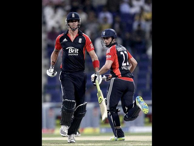 England's Kevin Pietersen, left, and Craig Kieswetter run between the wickets during the third Twenty20 cricket match against Pakistan at the Zayed Cricket Stadium in Abu Dhabi, United Arab Emirates. AP/Hassan Ammar