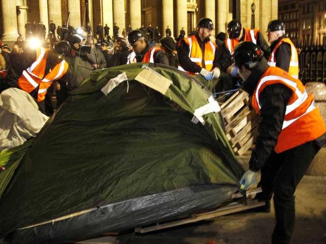 Bailiffs remove tents from the Occupy encampment in front of St Paul's Cathedral in London. (Reuters/Chris Helgren)