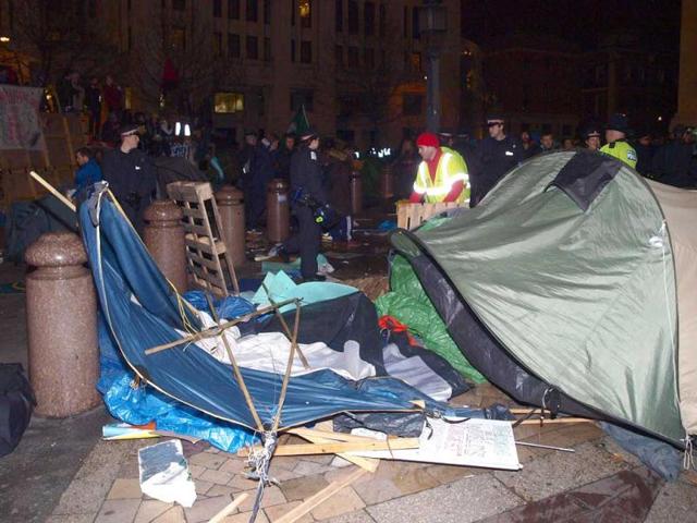 City of London Corporation bailiffs, backed by police, remove tents and other structures from the square in front of St Paul's Cathedral, where anti-capitalist protesters have been camped since mid-October in London. (AP Photo/PA, Max Nash)