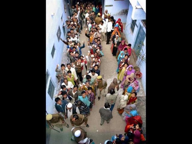 Voters-show-their-identity-cards-as-they-to-cast-votes-at-a-polling-station-during-sixth-phase-of-Uttar-Pradesh-assembly-elections-in-Agra-PTI-Photo- Voters-show-their-identity-cards-as-they-to-cast-votes-at-a-polling-station-during-sixth-phase-of-Uttar-Pradesh-assembly-elections-in-Agra-PTI-Photo-