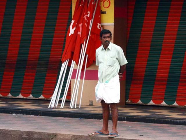 A man stands in front of a closed restaurant as he waits for the start of a protest march in Kochi. Hundreds of thousands of workers from several trade unions went on strike across the country to express their anger at soaring prices and to back demands for improved rights for employees, trade unions said. (Reuters)