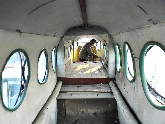 Li Jingchun, a 58-year-old farmer, sprays paints onto his self-made aircraft on top of his house in Xiahe village located in Shenyang, Liaoning province. The 5m long, 1.5m wide plane, mostly made of recycled iron plates, cost the aircraft enthusiast and his family two years and more than 40,000 yuan ($6,349), according to local media. Reuters/Sheng Li