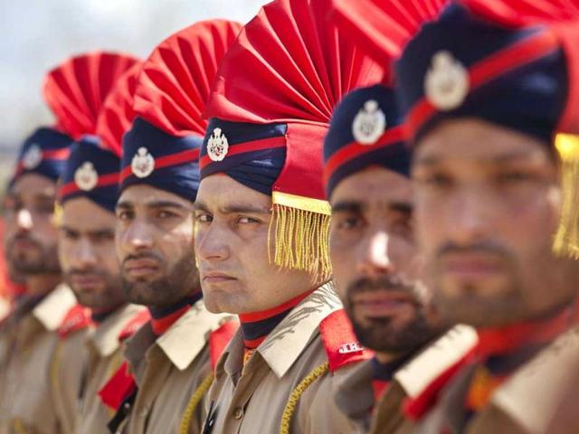 New recruits of Jammu and Kashmir Police participate in a passing-out parade ceremony in Manigham, 34 kilometers (21 miles) northeast of Srinagar. About 435 police officers have completed a twelve-month training for controlling street protests in Indian-controlled Kashmir, police said Friday. (AP Photo/Dar Yasin)