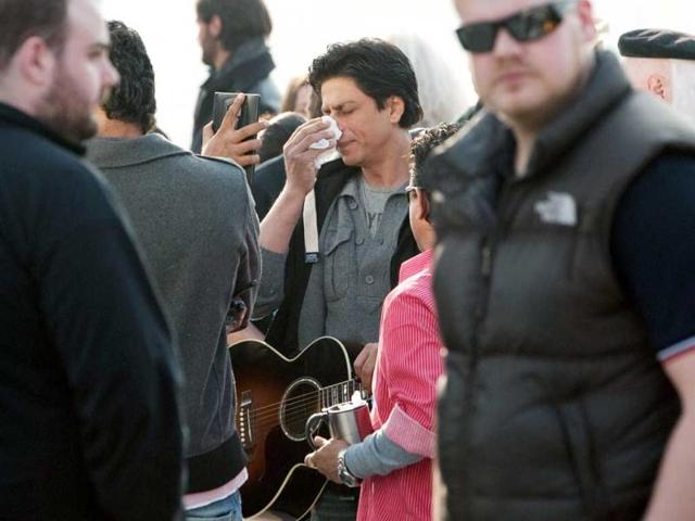 Shah Rukh Khan has his make-up checked between takes while filming on the Southbank in central London. Shah Rukh Khan has his make-up checked between takes while filming on the Southbank in central London.