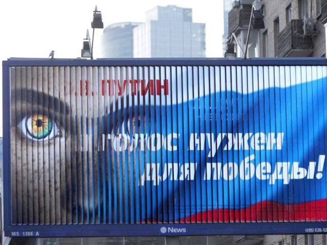 A pro-Putin election billboard reads 'V. Putin. Your vote is needed for victory' in downtown Moscow. AP Photo/Alexander Zemlianichenko