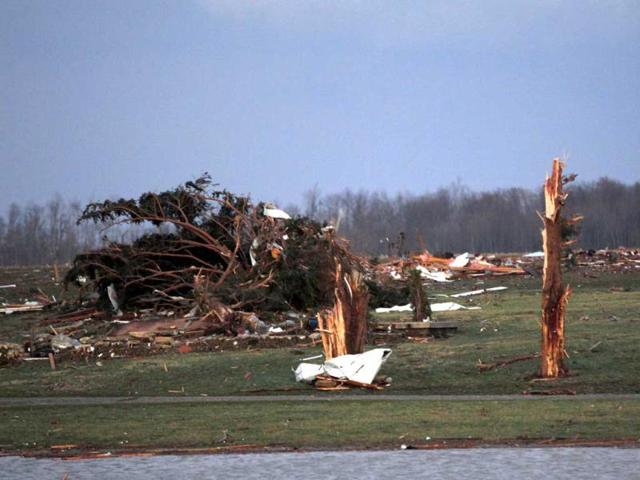 Broken trees are all that is left to be seen of a home where three people died, after three tornados moved through the area in Chelsea, Indiana. A series of tornadoes tore through the US midsection on Friday, killing at least four people in the hard-hit state of Indiana, and blowing apart homes and flattening buildings across the region. Reuters/ John Sommers II