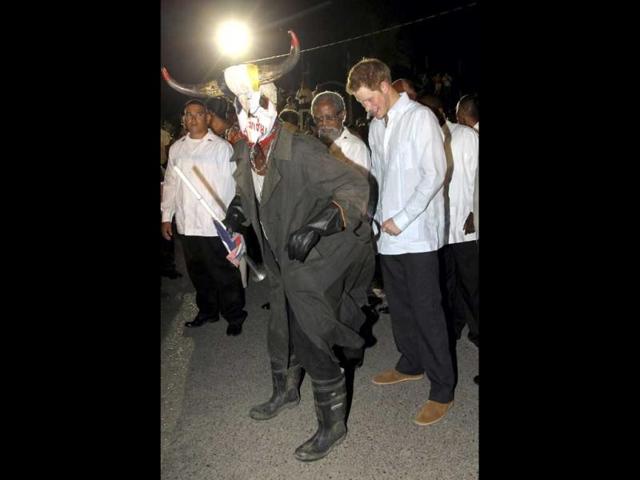 Britain's Prince Harry joins in a traditional dance at a Jubilee Block Party in Belmopan, Belize. The Prince is on a week-long tour through Central America and the Caribbean acting as an ambassador for Britain's Queen Elizabeth as part of her Diamond Jubilee. Reuters/Chris Jackson/Pool