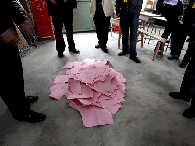 Ballots lie on the floor after being taken out from a ballot box following village election in Wukan, southern Chinese province of Guangdong. Residents of Wukan gathered to elect a new administrative authority that many hail as a model for greater grassroots democracy in China. Reuters/Bobby Yip