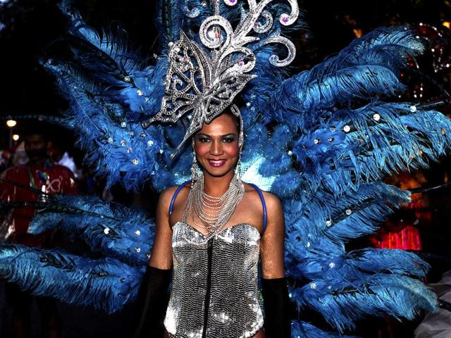 A performer wearing a feather costume walks along the street during the annual Sydney Gay and Lesbian Mardi Gras in Sydney, Australia, Saturday, March 3, 2012. (AP Photo)