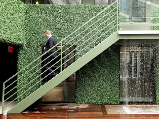 A man walks down stairs next to a waterfall at a new gay hotel, THE OUT NYC, in midtown Manhattan after the ribbon-cutting ceremony in New York City. (Mario Tama/Getty Images/AFP)