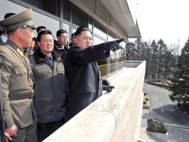 North Korean leader Kim Jong-un points towards South Korea as he visits the truce village of Panmunjom in the demilitarised zone separating the two Koreas, south of Pyongyang in this undated picture released by the North's KCNA news agency. Reuters Photo
