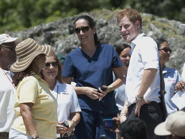 Britain's Prince Harry, center right, visits the Mayan temple at Xunantunich , Belize, on the second day of his ten-day tour to Belize, Bahamas, Jamaica, and Brazil. (AP Photo/Mark Large/Daily Mail /PA Wire)