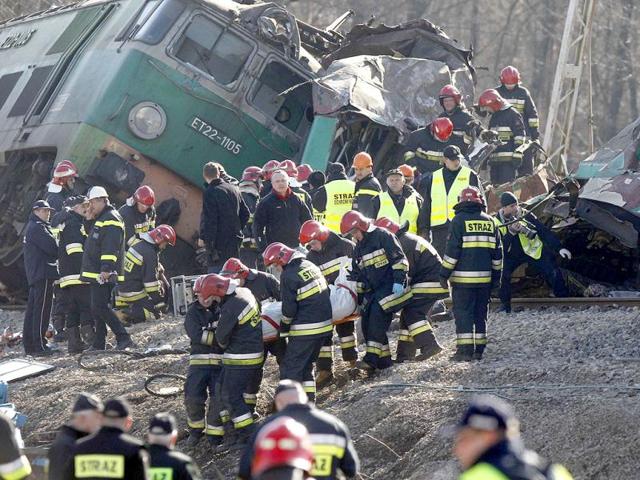 Polish emergency services workers remove the body of the 16th victim of a train crash near the town of Szczekociny. At least 16 people were killed when two passenger trains collided head-on in southern Poland late on Saturday in one of the country's worst train crashes in more than 20 years. The two trains carrying an estimated 350 passengers were heading in opposite directions on the same track when they crashed at high speed in a rural area near the town of Szczekociny. (Reuters)