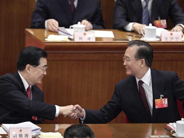 China's Premier Wen Jiabao (R) shakes hands with President Hu Jintao after the opening ceremony of the National People's Congress (NPC) at the Great Hall of the People in Beijing. Reuters/Jason Lee