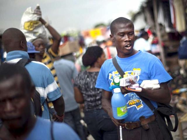Victor Osner 34, a blind vendor, hawks hygienic products at a local market in Port-au-Prince, Haiti. AP Photo/Ramon Espinosa