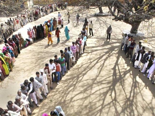 Voters-stand-in-a-queue-to-cast-their-votes-at-a-polling-station-near-Moradabad-By-turning-out-in-droves-at-the-elections-the-people-of-Uttar-Pradesh-have-not-only-silenced-the-critics-but-also-made-any-prediction-of-a-clear-winner-a-risky-proposition-AP-Manish-Swarup Voters-stand-in-a-queue-to-cast-their-votes-at-a-polling-station-near-Moradabad-By-turning-out-in-droves-at-the-elections-the-people-of-Uttar-Pradesh-have-not-only-silenced-the-critics-but-also-made-any-prediction-of-a-clear-winner-a-risky-proposition-AP-Manish-Swarup