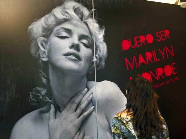 A visitor looks at a picture displayed at the exhibition "I want to be Marilyn Monroe", at the Cinemateca Brasileira in Sao Paulo, Brazil. (AFP photo/ Nelson Almeida)