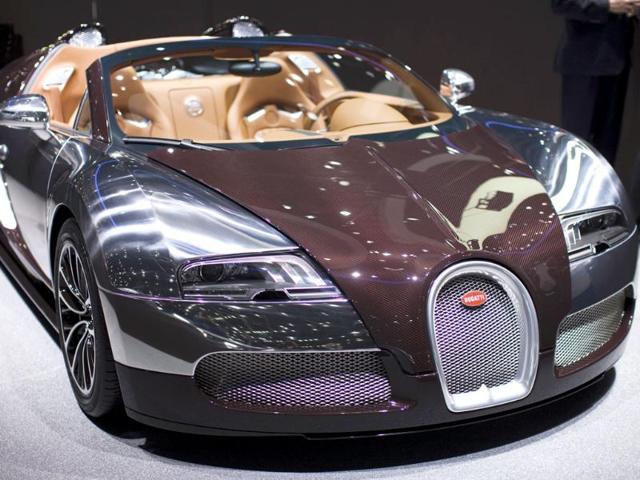 A Bugatti Veyron Grand Sport car is displayed on the car maker's booth during the first media day of the Geneva Auto Show at the . Reuters/Valentin Flauraud