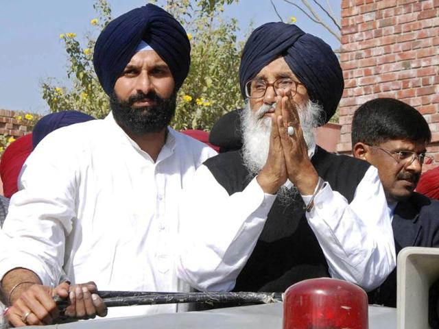 Punjab chief minister and Shiromani Akali Dal leader Parkash Singh Badal greets supporters after his party's win in Punjab assembly polls, in Bathinda. AP Photo/Prabhjot Gill