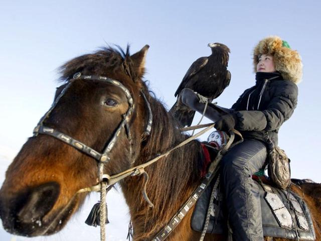 Makpal,who is a professionally trained as a lawyer, is the only female eagle hunter in Kazakhstan. She started learning falconry from her father at the age of 13. REUTERS/Shamil Zhumatov