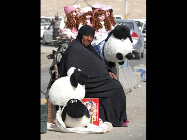 An Iraqi woman sells dolls on International Women's Day in Baghdad. Reuters/Mohammed Ameen