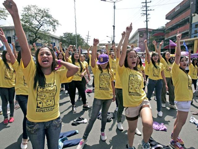 Filipino students dance during a rally near the Malacanang Palace to mark International Women's Day in Manila, Philippines. The women's group called for gender equality and also denounced the presence of US military in the country. AP/Aaron Favila