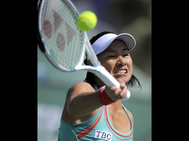 Kimiko Date-Krumm of Japan returns a shot to Pauline Parmentier of France at the BNP Paribas Open tennis tournament, Wednesday, in Indian Wells, California. (AP Photo)