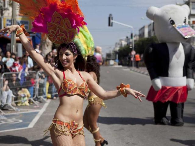 Israeli dancers perform during a Purim parade festival in Holon, Israel. AP Photo/Dan Balilty.