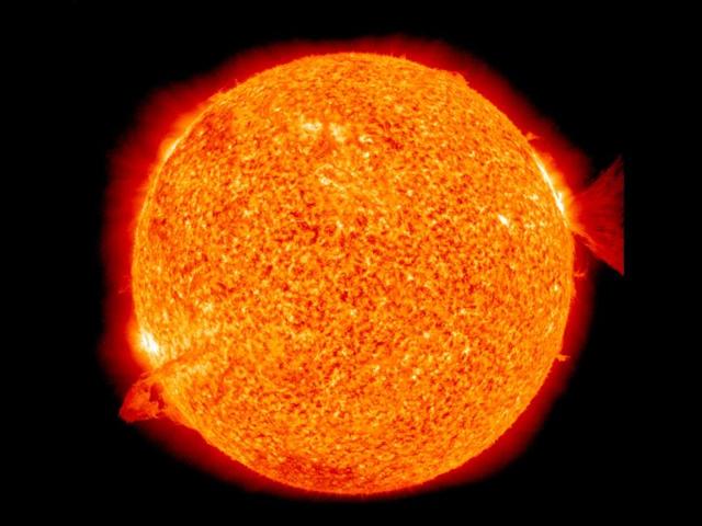 This image of the sun, captured by The Solar Dynamics Observatory spacecraft on January 28, 2011, shows nearly simultaneous solar eruptions on opposite sides of the sun (photograph released by Nasa). A filament on the left side became unstable and erupted, while an M-1 flare and a coronal mass ejection on the right blasted into space. Reuters/Nasa/Handout
