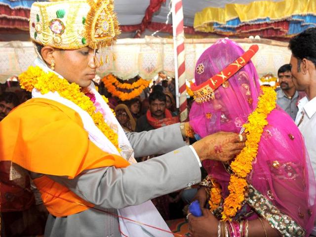A newly married couple garland each other in the village of Vadia, a so-called 'village of prostitutes', some 210km north of Ahmedabad. AFP/Sam Panthaky