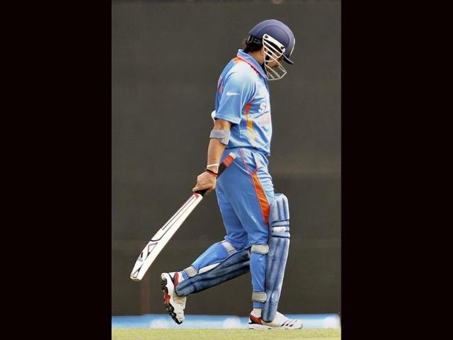 Sachin Tendulkar leaves the field after he lost his wicket during their Asia Cup cricket match against Sri Lanka in Dhaka, Bangladesh. AP/Aijaz Rahi