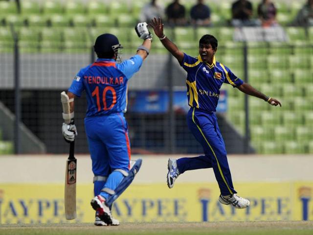 Sri Lankan bowler Nuwan Kulasekara (R) appeals unsuccessfully for a leg before wicket decision as Sachin Tendulkar reacts during their one day international Asia Cup cricket match at The Sher-e-Bangla National Cricket Stadium in Dhaka. AFP/Munir uz Zaman