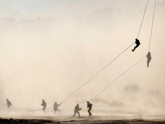 Indian and US army soldiers participate in a drill during a joint military exercise Yudh Abhyas 2011-12 in the desert near Bikaner, in the western Indian state of Rajasthan. (AP/Dinesh Gupta)