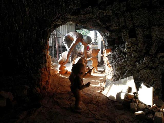 A worker moves clay statues out of a furnace in Baan Daan Kwien village in Nakhon Ratchasima province, northeast of Bangkok. Baan Daan Kwien is part of the One Tambon One Product (OTOP) scheme supporting local handicrafts in Thailand. (Reuters)