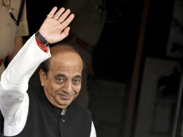 Dinesh Trivedi (C) waves as he arrives at his office before heading to present the annual budget for the country's railway system, at the parliament in New Delhi. The government will unveil the budget for the Indian Railways on Wednesday. Reuters/Vijay Mathur